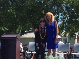 Antonio & his principal at his 8th grade promotion. 